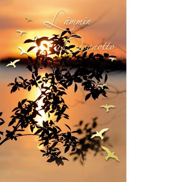Auringonlasku järvellä ja etualalla puun oksan tumma siluetti sekä kultaisia lintuja.